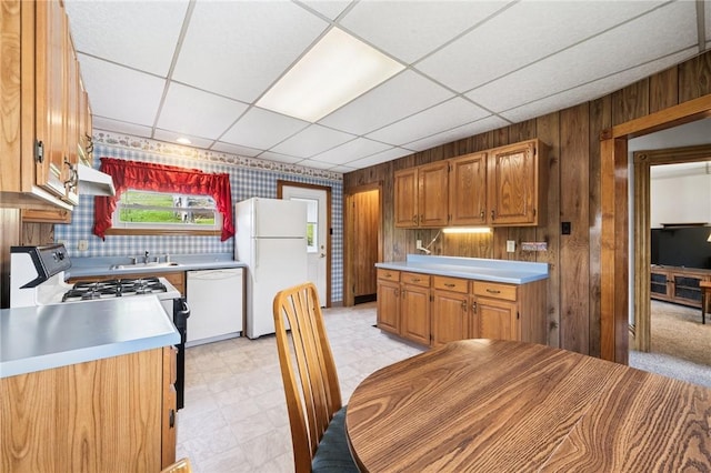 600 Scott St, Penn Twp Wml, PA 15675 - kitchen with white appliances, a sink, light countertops, range hood, and light floors