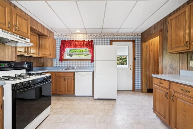600 Scott St, Penn Twp Wml, PA 15675 - kitchen featuring white appliances, under cabinet range hood, light countertops, plenty of natural light, and a paneled ceiling