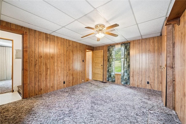 600 Scott St, Penn Twp Wml, PA 15675 - unfurnished room featuring a ceiling fan, carpet, wooden walls, and a paneled ceiling