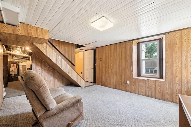 600 Scott St, Penn Twp Wml, PA 15675 - carpeted living room featuring wood walls, stairs, and water heater