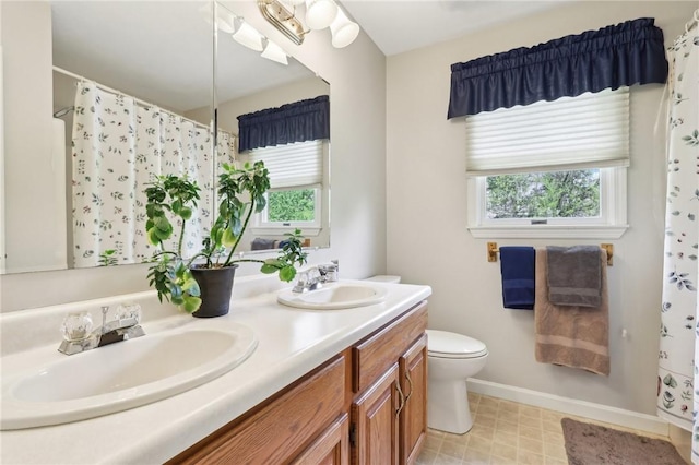 1025 Manor Vue Ct, Murrysville, PA 15626 - full bathroom with healthy amount of natural light, double vanity, a shower with shower curtain, and tile patterned floors