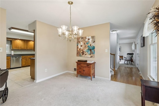 1025 Manor Vue Ct, Murrysville, PA 15626 - dining space with a chandelier and light colored carpet