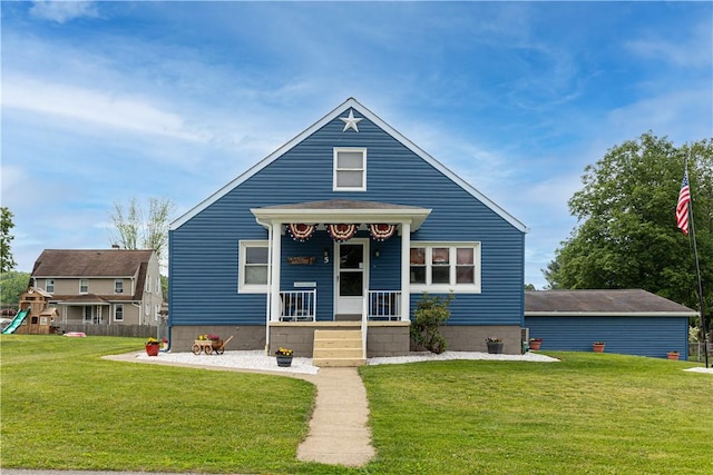 5 Beach St, Centerville, PA 15358 - bungalow-style home with a front lawn, covered porch, and a playground