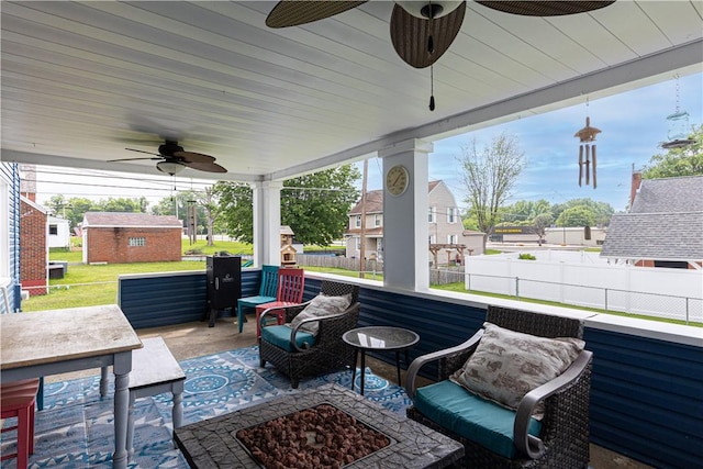 5 Beach St, Centerville, PA 15358 - view of patio with ceiling fan and a fire pit