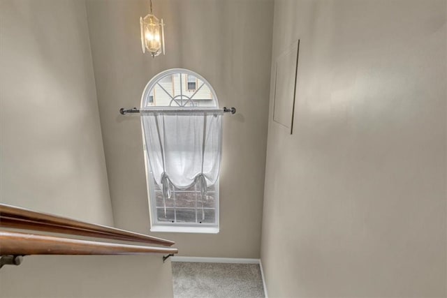 309 Wildflower Ct, Ross Twp, PA 15202 - stairway featuring a chandelier, carpet flooring, and baseboards