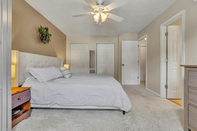 309 Wildflower Ct, Ross Twp, PA 15202 - carpeted bedroom featuring two closets, baseboards, and ceiling fan
