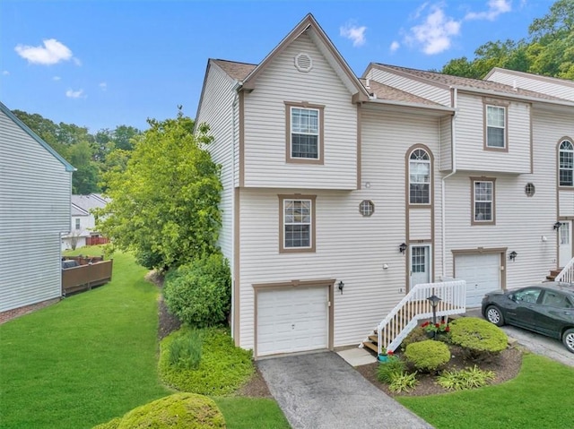 309 Wildflower Ct, Ross Twp, PA 15202 - view of front of home with a garage, driveway, and a front lawn