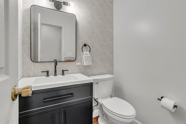 309 Wildflower Ct, Ross Twp, PA 15202 - half bath featuring toilet, vanity, and baseboards