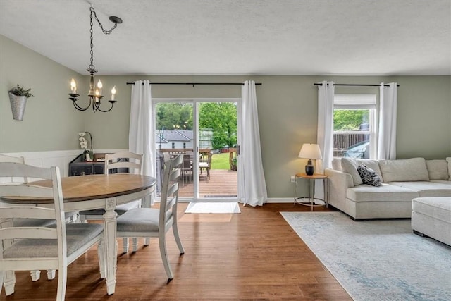 309 Wildflower Ct, Ross Twp, PA 15202 - dining space with a chandelier and wood finished floors