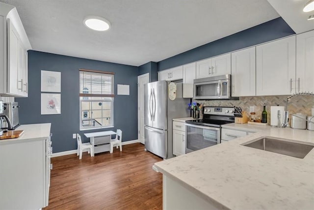 309 Wildflower Ct, Ross Twp, PA 15202 - kitchen featuring appliances with stainless steel finishes and white cabinetry