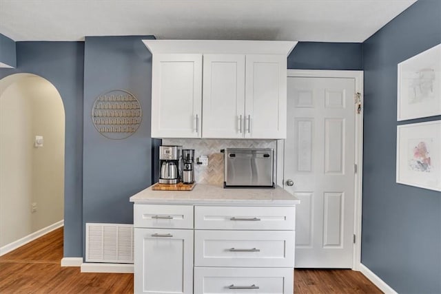 309 Wildflower Ct, Ross Twp, PA 15202 - kitchen featuring baseboards, dark wood-style floors, white cabinetry, and tasteful backsplash