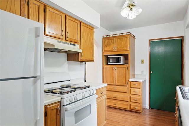 1122 Tyndall St, Sheraden, PA 15204 - kitchen with white appliances, under cabinet range hood, light wood-style flooring, light countertops, and ceiling fan