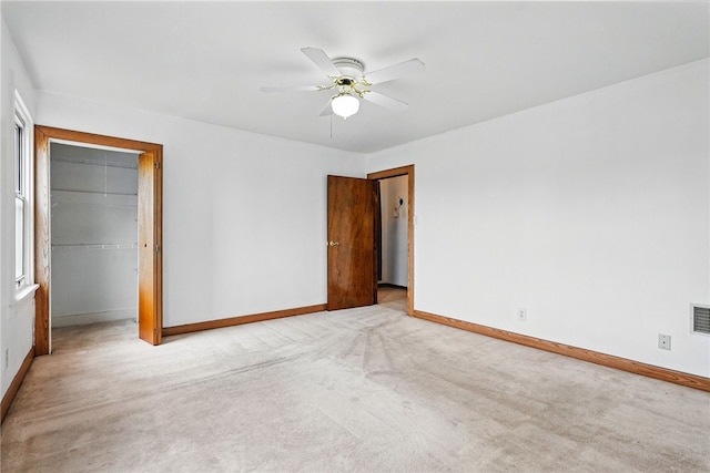 1122 Tyndall St, Sheraden, PA 15204 - unfurnished bedroom featuring baseboards, a closet, carpet floors, and a walk in closet
