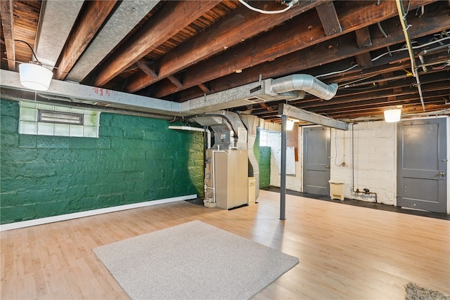 1122 Tyndall St, Sheraden, PA 15204 - basement with heating unit and wood finished floors