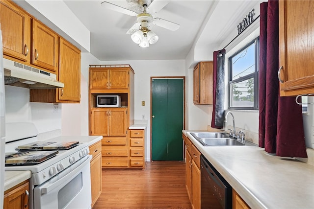 1122 Tyndall St, Sheraden, PA 15204 - kitchen with a sink, white range with gas stovetop, under cabinet range hood, stainless steel microwave, and dishwasher