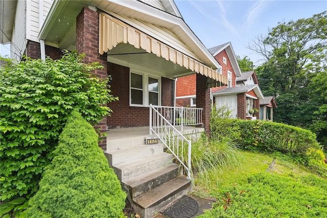 1122 Tyndall St, Sheraden, PA 15204 - view of exterior entry with brick siding and covered porch