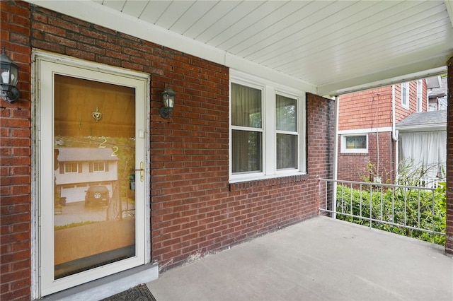 1122 Tyndall St, Sheraden, PA 15204 - doorway to property with covered porch and brick siding