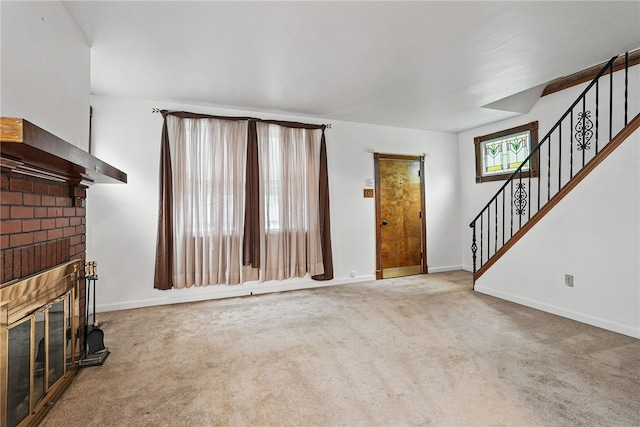 1122 Tyndall St, Sheraden, PA 15204 - unfurnished living room featuring a brick fireplace, stairway, carpet flooring, and baseboards