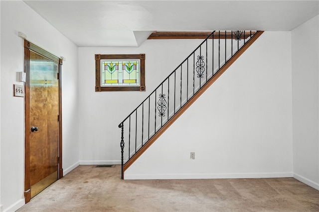 1122 Tyndall St, Sheraden, PA 15204 - foyer entrance featuring carpet flooring, stairs, and baseboards