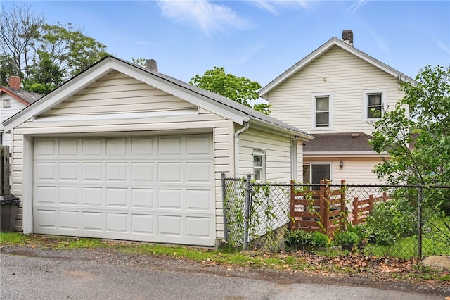 1122 Tyndall St, Sheraden, PA 15204 - view of front facade featuring a chimney and a garage