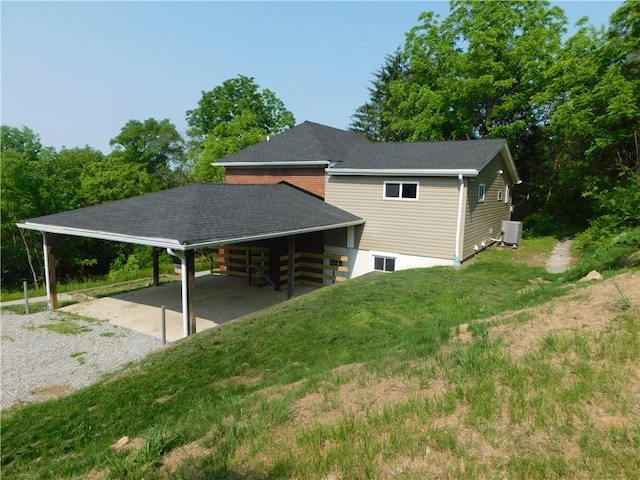 137 Limerick Rd, Sewickley Twp, PA 15637 - view of property exterior featuring driveway, central AC unit, and an attached carport