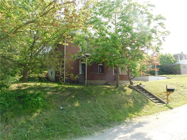 137 Limerick Rd, Sewickley Twp, PA 15637 - view of side of property featuring brick siding and a lawn