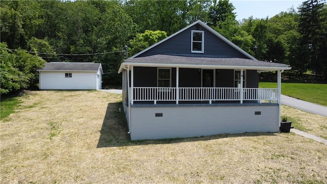 500 Main St, North Union Twp, PA 15456 - view of front of property with a front lawn, crawl space, a view of trees, and an outbuilding