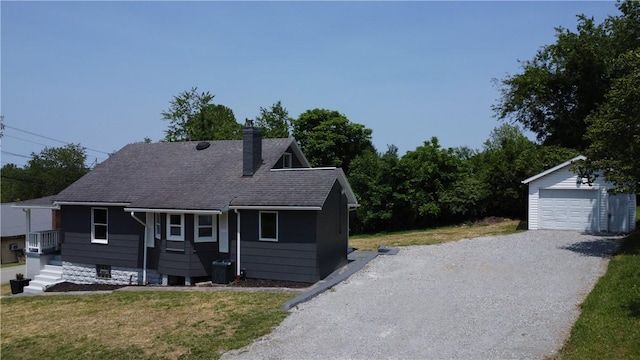 500 Main St, North Union Twp, PA 15456 - view of front of property with an outbuilding, a chimney, a front lawn, gravel driveway, and roof with shingles