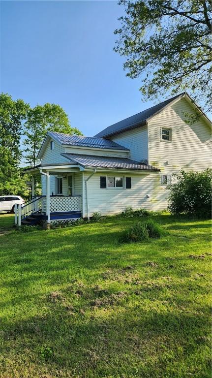 1737 Perry Hwy, Volant, PA 16156 - back of property with a porch and a yard