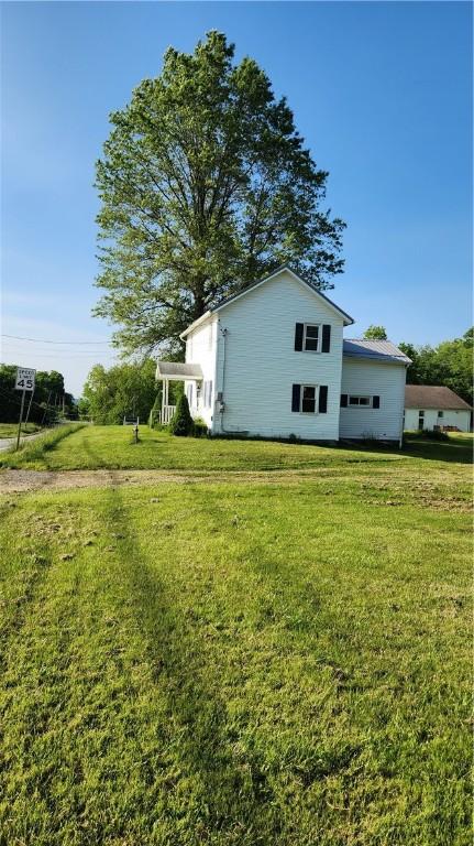1737 Perry Hwy, Volant, PA 16156 - view of property exterior with a lawn
