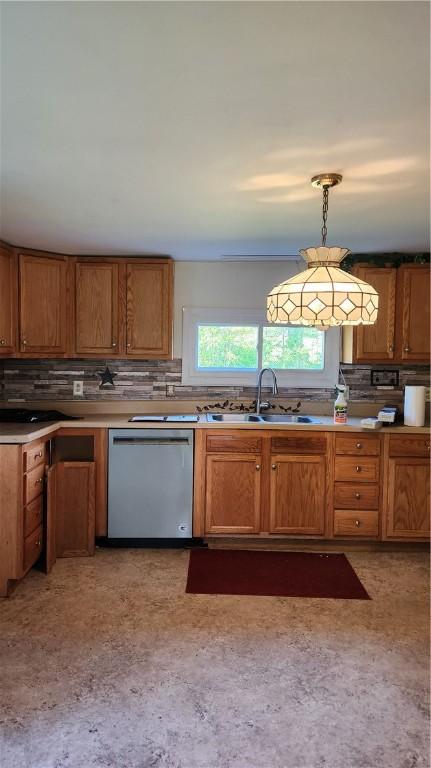 1737 Perry Hwy, Volant, PA 16156 - kitchen featuring stainless steel dishwasher, a sink, tasteful backsplash, brown cabinets, and pendant lighting