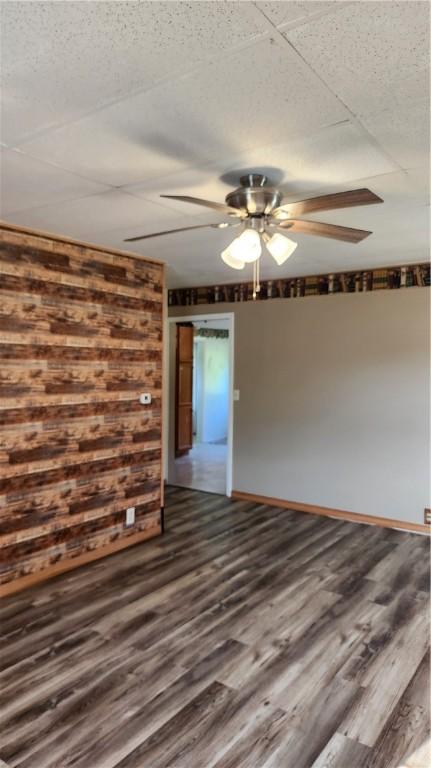 1737 Perry Hwy, Volant, PA 16156 - spare room featuring a ceiling fan, dark wood-type flooring, and baseboards