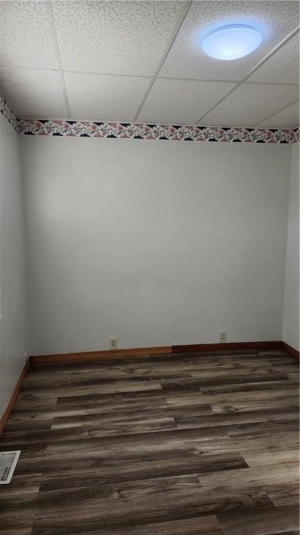 1737 Perry Hwy, Volant, PA 16156 - spare room featuring a paneled ceiling, dark wood-style flooring, and baseboards