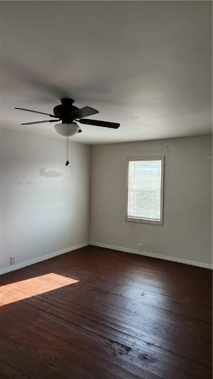 1737 Perry Hwy, Volant, PA 16156 - spare room with dark wood-type flooring, baseboards, and a ceiling fan