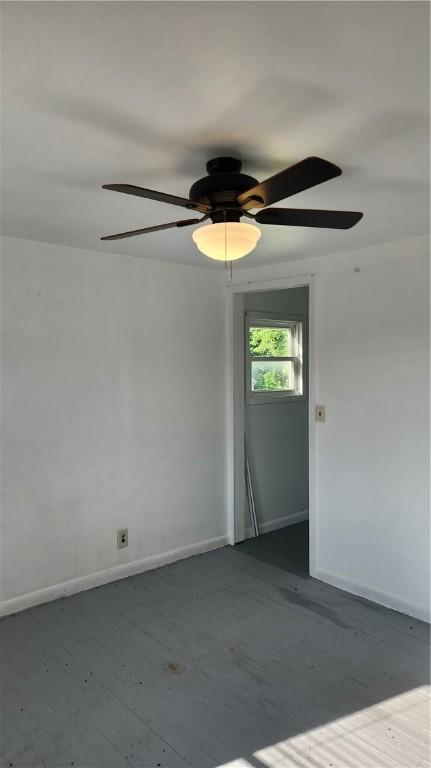 1737 Perry Hwy, Volant, PA 16156 - empty room with a ceiling fan, baseboards, and wood finished floors