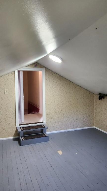 1737 Perry Hwy, Volant, PA 16156 - bonus room featuring hardwood / wood-style flooring, lofted ceiling, and baseboards