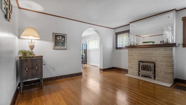 2536 Middletown Rd, Crafton Heights, PA 15205 - unfurnished living room featuring ornamental molding, arched walkways, hardwood / wood-style flooring, and baseboards