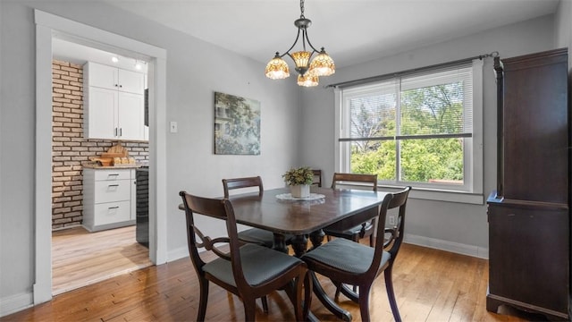 2536 Middletown Rd, Crafton Heights, PA 15205 - dining room featuring light wood-style flooring, baseboards, and a chandelier