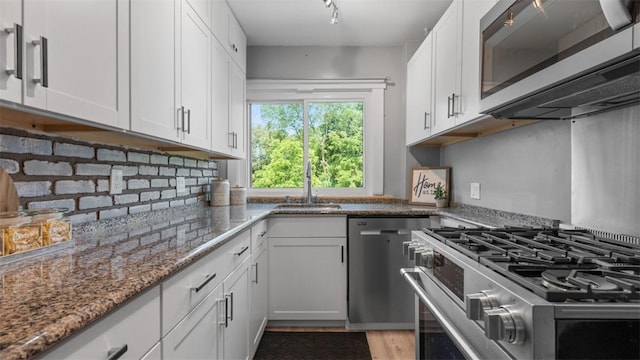 2536 Middletown Rd, Crafton Heights, PA 15205 - kitchen featuring stainless steel appliances, a sink, white cabinets, and stone countertops