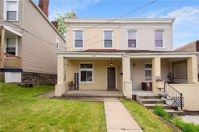 1313 Virginia Ave, Mt Washington, PA 15211 - view of front facade with a porch, a front lawn, and stucco siding