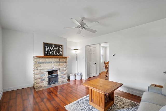 1313 Virginia Ave, Mt Washington, PA 15211 - living room with baseboards, ceiling fan, wood finished floors, and a stone fireplace