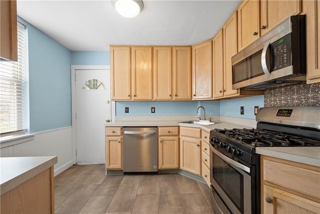 1313 Virginia Ave, Mt Washington, PA 15211 - kitchen featuring stainless steel appliances, light brown cabinetry, a sink, plenty of natural light, and wainscoting