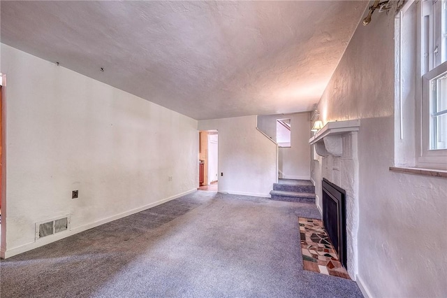 3333 Walther Ln, Upper St Clair, PA 15241 - unfurnished living room with a fireplace, baseboards, plenty of natural light, a textured ceiling, and carpet
