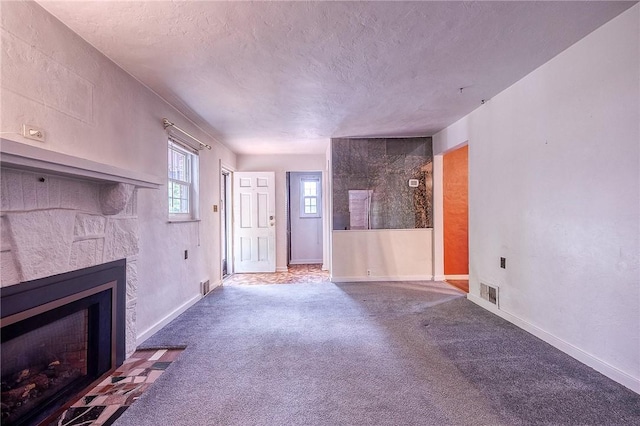 3333 Walther Ln, Upper St Clair, PA 15241 - unfurnished living room featuring a fireplace with flush hearth, a textured ceiling, carpet, and baseboards