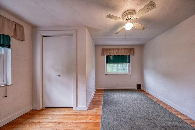 3333 Walther Ln, Upper St Clair, PA 15241 - unfurnished bedroom featuring baseboards, light wood-type flooring, and a ceiling fan