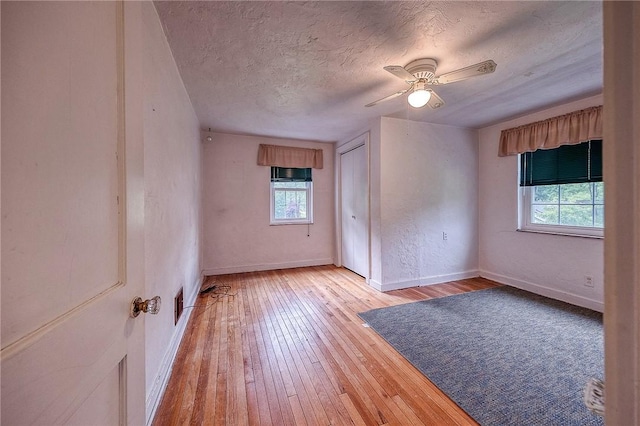 3333 Walther Ln, Upper St Clair, PA 15241 - unfurnished room featuring healthy amount of natural light, light wood-style flooring, a textured ceiling, baseboards, and ceiling fan