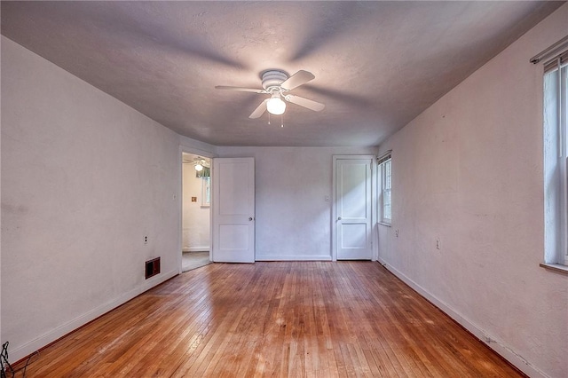 3333 Walther Ln, Upper St Clair, PA 15241 - unfurnished bedroom with wood-type flooring, baseboards, and multiple windows