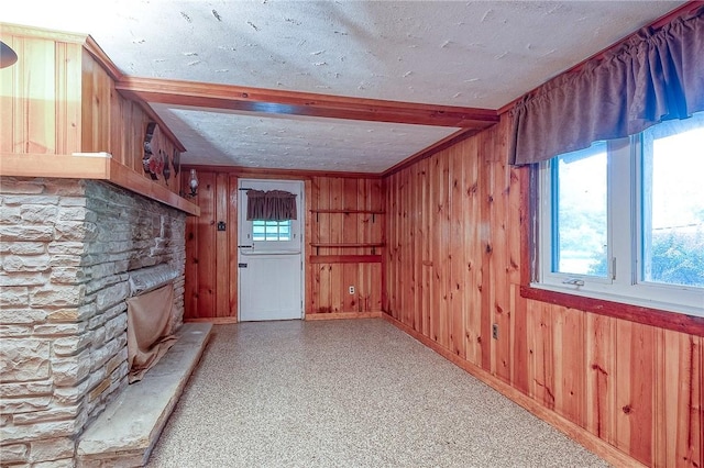 3333 Walther Ln, Upper St Clair, PA 15241 - interior space with wooden walls, a stone fireplace, a textured ceiling, and beam ceiling