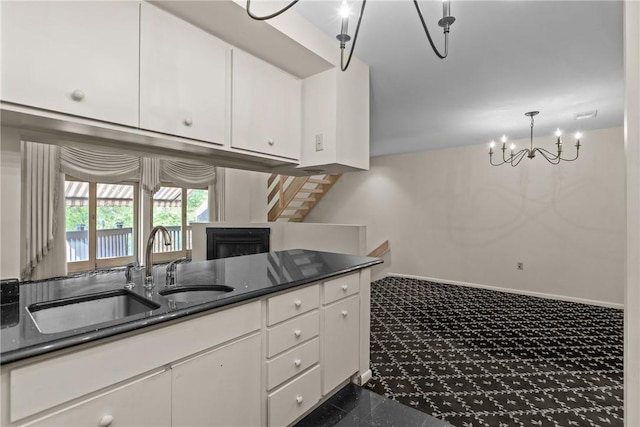 2811 Leona Ln, Robinson Twp Nwa, PA 15108 - kitchen featuring white cabinets, a chandelier, baseboards, and dark stone countertops