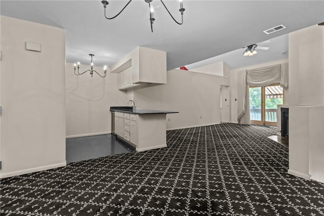 2811 Leona Ln, Robinson Twp Nwa, PA 15108 - kitchen with a chandelier, dark colored carpet, dark countertops, white cabinetry, and a sink